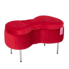 the foot stool is made out of red velvet and has two circular seats on each side