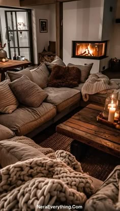 a living room filled with furniture and a fire place