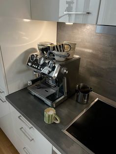 an espresso machine sitting on top of a counter