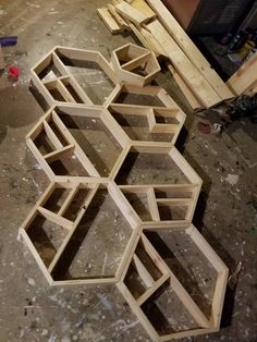 several wooden shelves sitting on top of a floor