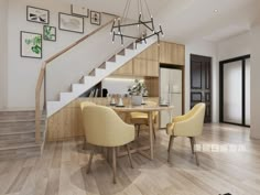 a dining room table and chairs under a stair case with pictures on the wall above it