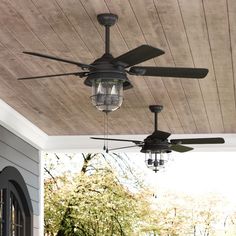 an outdoor ceiling fan with three lights on it and a chandelier hanging from the ceiling