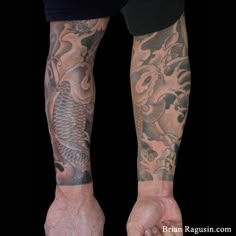 a man's arm with tattoos on it