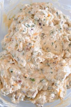 a bowl filled with chicken salad on top of a table