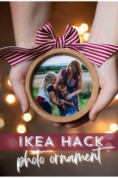 two hands holding an ornament that says ikea hack photo ornament