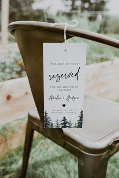 a sign that says reserved for the mother of the bride is hanging on a chair