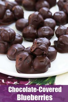 chocolate covered blueberries on a plate with the words chocolate covered blueberries above them