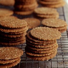 some cookies are cooling on a rack and ready to be baked in the oven for consumption