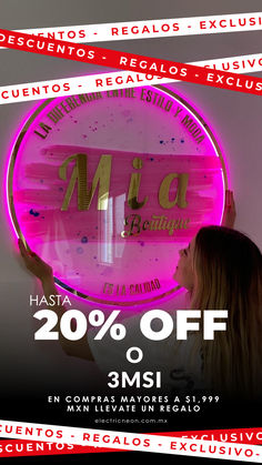 a woman standing in front of a neon sign with the words 20 % off on it