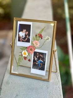 an old photo frame with flowers and two photos in it sitting on top of a cement slab