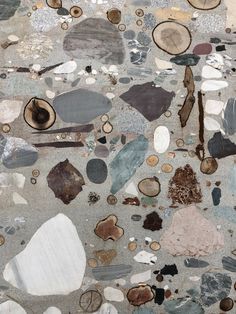 an abstract piece of art made out of various different types of rocks and gravels