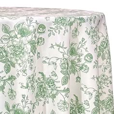 a green and white table cloth with flowers on it, in front of a white background