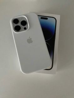 an apple iphone 11 pro in its box with the back cover removed from it's packaging