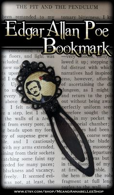 the edgar allen poe bookmark is shown on top of an open book with black trim