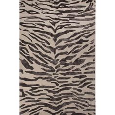 an animal print rug with black and white stripes