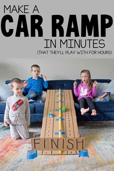 kids playing with an easy car ramp game on the floor in front of a couch