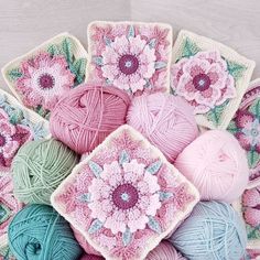 several balls of yarn and crochet are arranged in the shape of square flowers