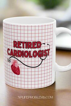 a coffee mug with the words retired cardiolist on it and a stethoscope