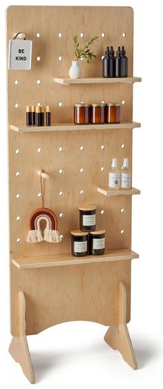 a wooden shelf with various items on it and some shelves above them that have different types of body care products