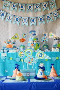 a birthday party with blue and green decorations