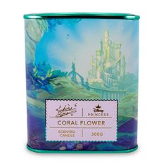 a candle tin with the image of a castle and seaweed on it, in front of a white background