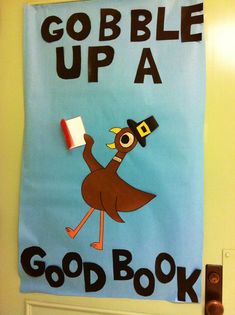 a bulletin board that says gobble up a good book on the front door with an ostrich holding a flag