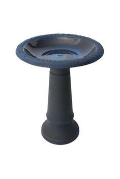 a gray pedestal with a blue bowl on top