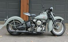 a motorcycle parked in front of a garage door