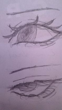 an eye drawn in pencil on a piece of paper