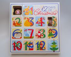 a christmas card with numbers and animals on it's front, sitting on a table