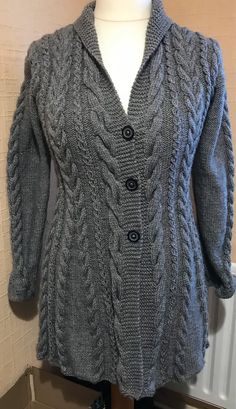 Hand knitted ladies fitted jacket Cable design 3 button fastening Knitted in a soft Aran wool Size medium 96cm or 38 inch chest Waist 86 cm or 35 inch Under arm sleeve 49cm or 18 in Bottom hem 140 cm or 56inch Length from nape to hem 140 cm or 31 inch Hand knitted in a smoke and pet free home Wash on delicates or woollens  DO NOT TUMBLE DRY Cable Knitting Patterns, Handmade Aprons, Ladies Sweater, Knit Basket, Knitted Jacket, Crochet Sandals, Fitted Jacket, Arm Sleeve, Knitted Pullover Sweaters