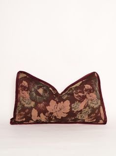 a decorative pillow with flowers on it