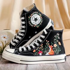 Custom Embroidered Converse High Tops 1970s, Fox Embroidered Converse Shoes, Fox and Flowers Embroidered Sneakers, Funny Halloween Gifts, Gift for Her 💚 Immerse yourself in the intricate craftsmanship as we lovingly hand embroider rustic flowers onto your chosen Converse pair 💚 🌿 The listed price encompasses both the Converse Shoes and the showcased Embroidery Designs. 1. MANUFACTURING PROCEDURE 🌿 Upon receiving your order, we initiate the shoe preparation process. If your chosen shoes are r Painted High Tops, Halloween Converse, Painted Converse High Tops, Embroidered Converse High Tops, Fox And Flowers, Converse Chuck 70s, Converse Embroidery, High Converse, Painted Converse