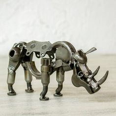 an animal made out of metal parts on a table