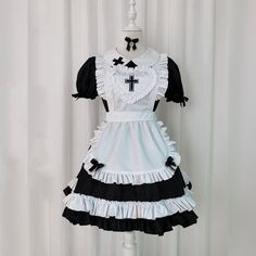 Kawaii Cross Print Ruffled Maid Lolita Dress Set Elevate your style with our Kawaii Cross Print Ruffled Maid Lolita Dress Set. Embrace the elegant design and stand out in a crowd. Feel confident and effortlessly chic in this unique set. Perfect for any occasion. Size Info. S: Bust 86 cm. Waist 70 cm. Length 80 cm M: Bust 90 cm. Waist 74 cm. Length 81 cm L: Bust 94 cm. Waist 78 cm. Length 82 cm XL: Bust 98 cm. Waist 82 cm. Length 83 cm 2XL: Bust 102 cm. Waist 86 cm. Length 84 cm 3XL: Bust 106 cm. Kawaii Swimsuit, Dark Academia Clothing, Anime Lingerie, Aesthetic Dark Academia, Cottagecore Fashion, Kawaii Dress, Maid Dress, Princess Style, Dress Set