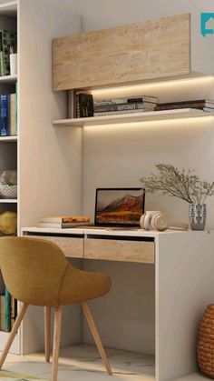 a desk with a laptop on it next to a chair and bookshelf in a room