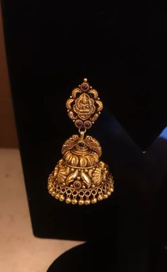 the gold earrings are on display for people to see