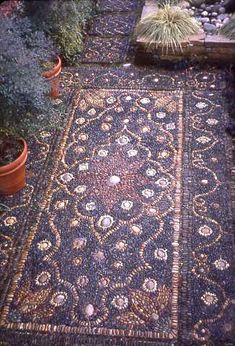 an outdoor area with potted plants and rugs