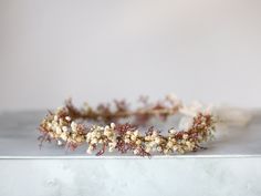 A whimsical flower crown in beautiful tones of beige, brown ang burgundy. Thanks to the use of dried flowers and artificial leaves, the crown is durable. Dried baby breath adds lightness to the composition. It is a special touch to your bohemian look. A flower crown is more beautiful than the pictures. Is perfect for garden wedding. Head circumference: one size fits all (adjustable) / fits adults and older children If the crown should fit the baby, after buying please give head circumference We Dainty Flower Crown, Vintage Flower Crown, Dried Baby Breath, Floral Boutonniere, Accessories Matching, Dried Flower Crown, Whimsical Flower, Artificial Leaves, Baby Breath