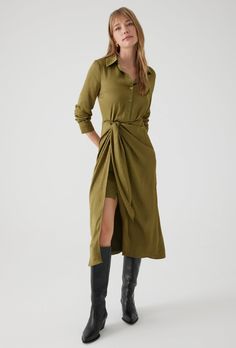 Unleash your quirky style with the Almeda Dress by Exquise. This midi dress features a playful twist knot detail and a flirty front slit. With 3/4 sleeves and a front top button closure, this dress will have you feeling effortlessly stylish. 100% Asetat Dry Clean Only Quirky Style, Twist Knot, Khaki Dress, Top Women, Olive Green, Houston, Casual Dresses, Knot, Dry Clean