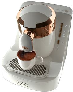 a white coffee machine with an espresso in it