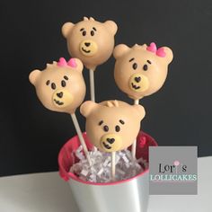 four brown teddy bears in a cup with marshmallows