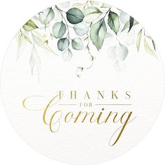 the words thanks for coming written in gold foil on a white circle with green leaves