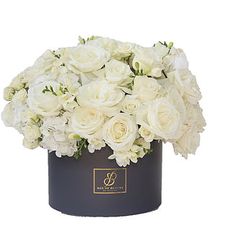 white flowers in a black box on a white background