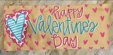 a happy valentine's day sign with hearts on it