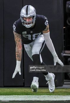 a football player diving into the air with his foot in midair during a game