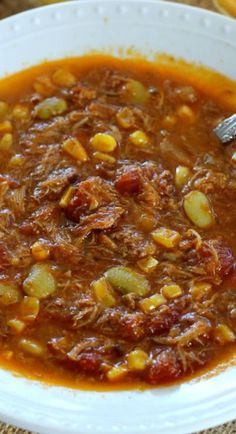 a white bowl filled with chili and beans