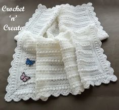 a crocheted blanket with butterfly applique on it and the words crochet in'create '