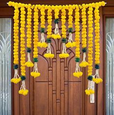 the door is decorated with yellow flowers and pineapples hanging from it's side