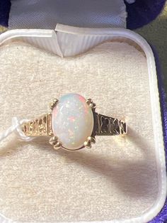 Stunning size O 9 ct gold and Opal ring Classic Gold Opal Gemstone Ring, Anniversary Opal Ring Stamped 14k In Oval Shape, Classic Gold Opal Ring As Gift, Classic Gold Opal Ring For Gift, Oval Opal Ring Stamped 14k For Anniversary, Classic Opal Birthstone Ring, Hallmarked 14k Gold Opal Ring, Oval Shape, Oval Opal Ring In 14k Gold, Hallmarked, Victorian Gold Opal Ring Gift